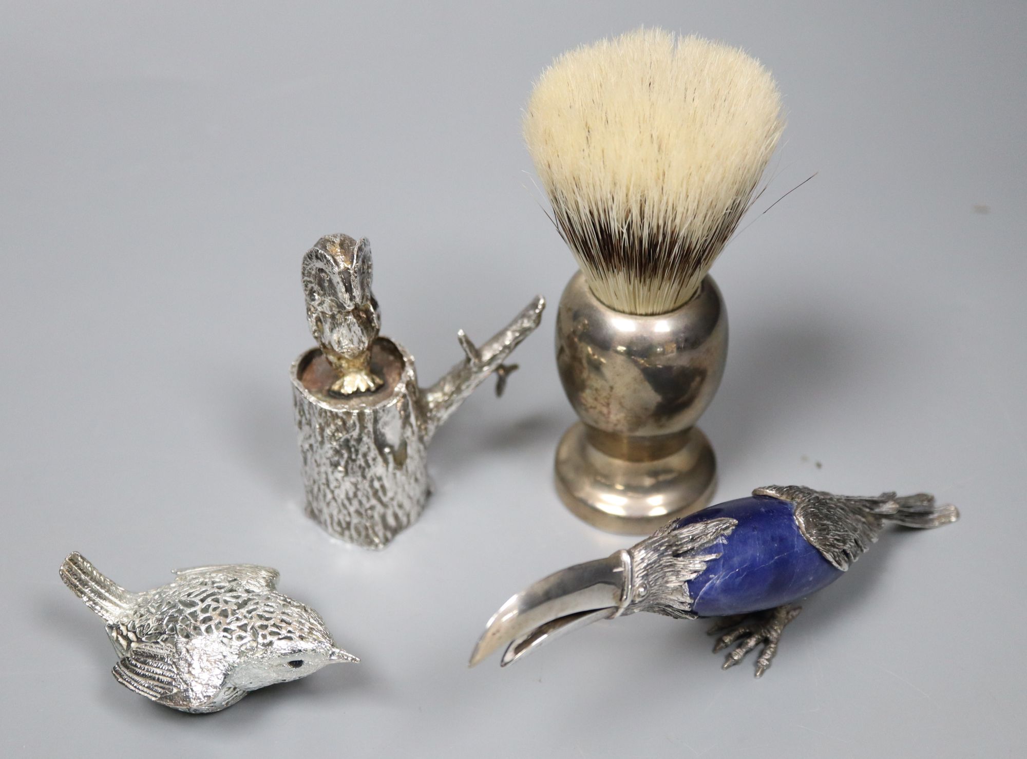 A group of small silver, plated and white metal items